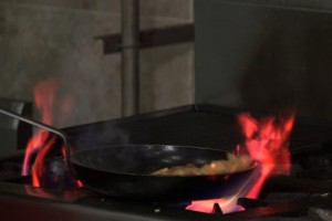 A pan of food on top of a stove.